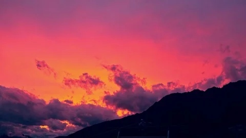 Pink and orange clouds at sunset Stock Footage 79338126