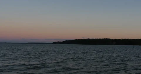 Pink and Orange Sunset with Clouds Over James River Wide, 4K  Stock Footage 68752440