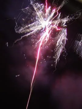 Pink and purple firework exploding Foto stock