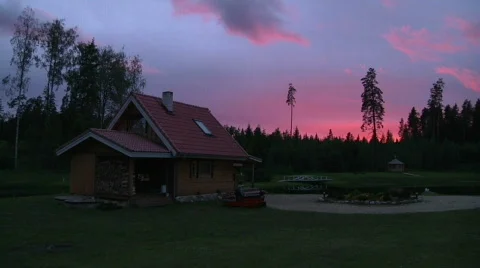 Pink and purple sky above estonian sauna Stock Footage