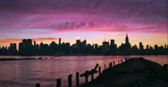 Pink And Purple Sky Above The Midtown Manhattan Skyline In The Early Morning. Stock Footage