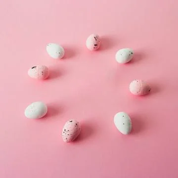Pink and white easter eggs, quail, circle frame. Stock Photos