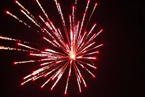Pink and white exploding fireworks Foto stock