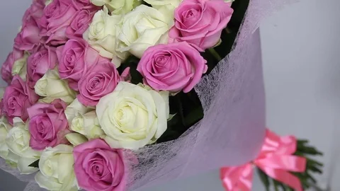 Pink and white roses bouquet turns. camers at angle Stock Footage