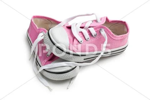 Pink baby sneakers Stock Photos
