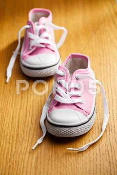 Pink baby sneakers Stock Photos