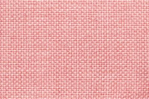 Pink background with braided checkered pattern, closeup. Texture of the weavi Stock Photos