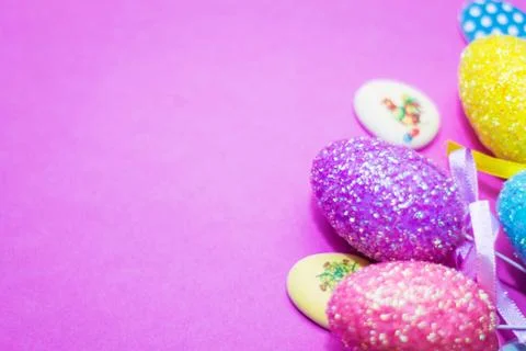 On a pink background close-up of colored Easter eggs, holiday Stock Photos