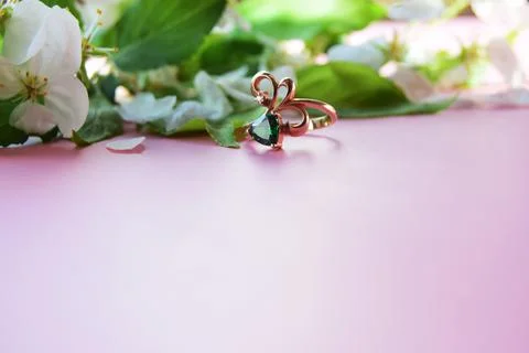 Pink background with ring and apple flowers. Valentine's Day engagement card  Stock Photos