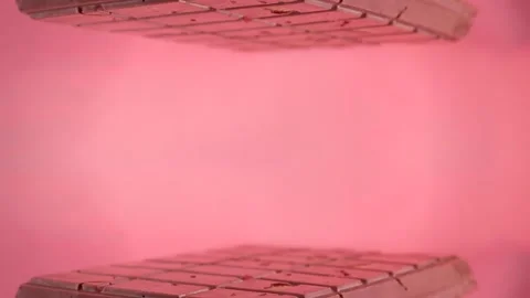 Pink background with ruby chocolate bar Video stock 264928606