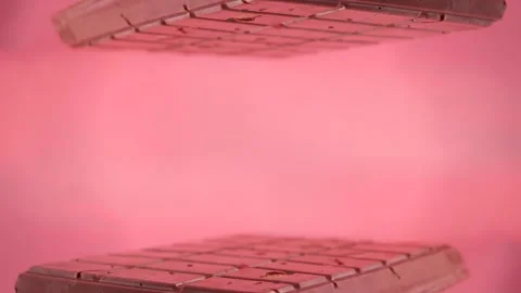 Pink background with ruby chocolate bar on March 8 Video stock 265315814