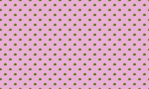Pink background with small green and yellow polka dots pattern Stock Illustration