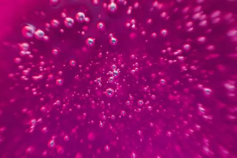 Pink background, texture with bubbles in some liquid. Stock Photos