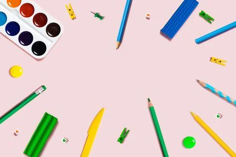 Pink background with writing materials. Stock Photos