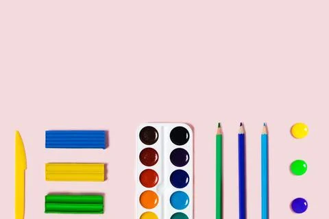 Pink background with writing materials. Stock Photos