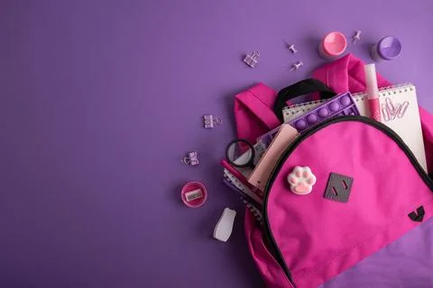 Pink backpack with school supplies Stock Photos