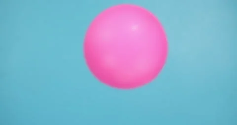 Pink Ball on a Blue Background Stock Footage 212650967