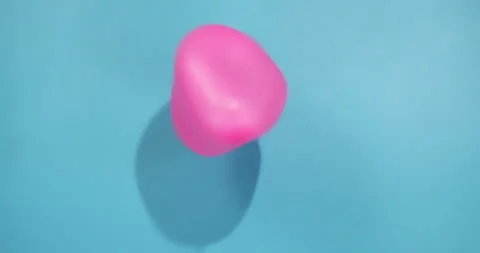 Pink Ball on a Blue Background Stock Footage 212651966