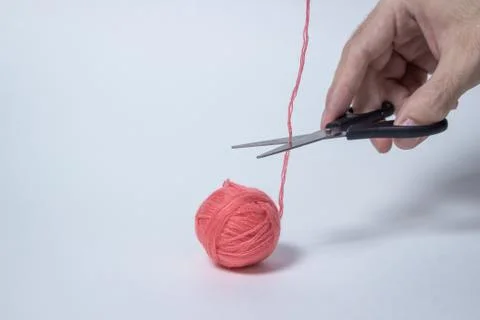 Pink ball of thread on a white background. T Stock Photos