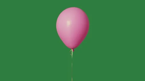 A pink balloon floating on green screen and animated chromakey background Video stock 335122385