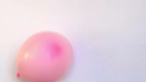 Pink balloon in shape of heart inflating and deflating slowly video, symbol of Stock Footage 172341818