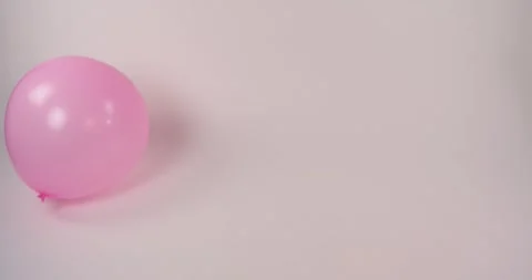 Pink Balloons bouncing, infinite white background (H264) Video stock 240621910