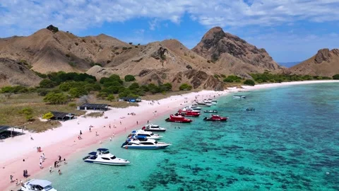 Pink Beach and Blue Ocean with Speedboat in Labuan Bajo, Indonesia. Stock Footage 341174631