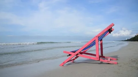 Pink beach chair Video stock 56948359