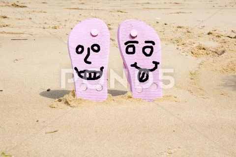 Pink Beach Flip Flops With In White Sand On Sea Background