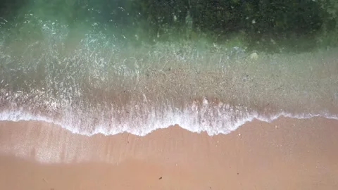 Pink beach on small waves sea Stock Footage 170217772