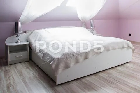 Pink bedroom with double bed Stock Photos