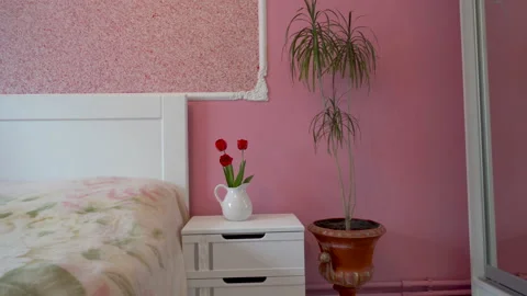 Pink bedroom with white bed Video stock 147927199