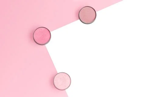 Pink, beige and ivory blushes, eyeshadows or highlighters on pink and isolate Stock Photos