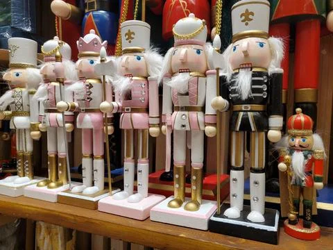 Pink , black and red nutcracker figurines on display for holidays Stock Photos