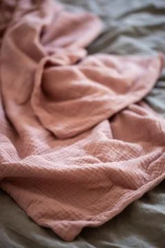 Pink blanket on the bed close up Stock Photos