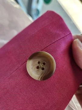 Pink blazer button on outer sleeve Foto stock