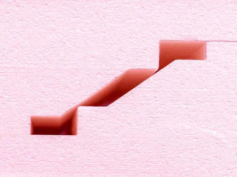 Pink blocks of a complex profile lie in stacks - close-up of decorative panel Stock Photos