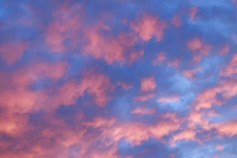 Pink blue cloudscape romantic evening sunset lighting background pattern Stock Photos
