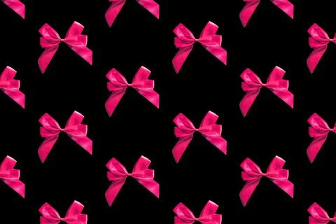Pink bows pattern on black background. Gift wrapping Stock Photos