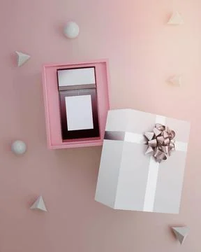 Pink box with an empty and blank perfume bottle inside, against a pink backgroun Stock Photos