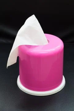 Pink box of tissues  on black background. Stock Photos