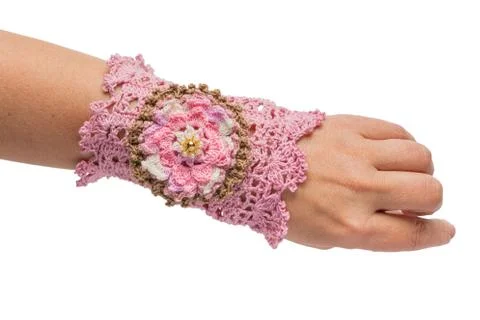 The pink bracelet embroidered with threads Stock Photos