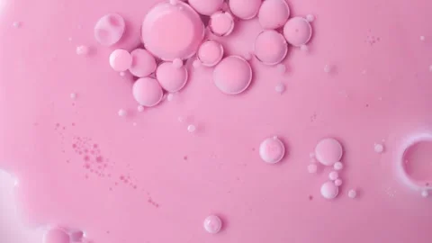 Pink bubbles of paint on an oil surface. Acrylic paint. Stock Footage 266973737