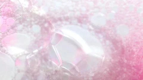 Pink bubbles of soap foam flow down.Cleanliness and hygiene background. Stock Footage 318981741