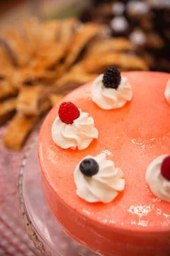 Pink cake close-up on the table in a cafe Stock Photos