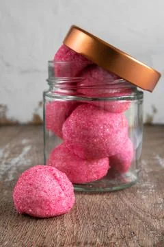Pink candy on rustic background Stock Photos