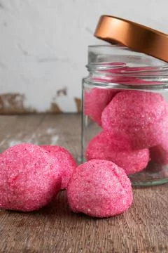 Pink candy on rustic background Stock Photos