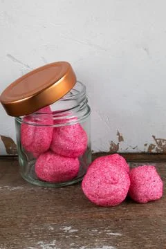 Pink candy on rustic background Stock Photos