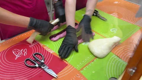 Pink Candy Sticks Being Rolled By Hand Vídeo Stock 342511042