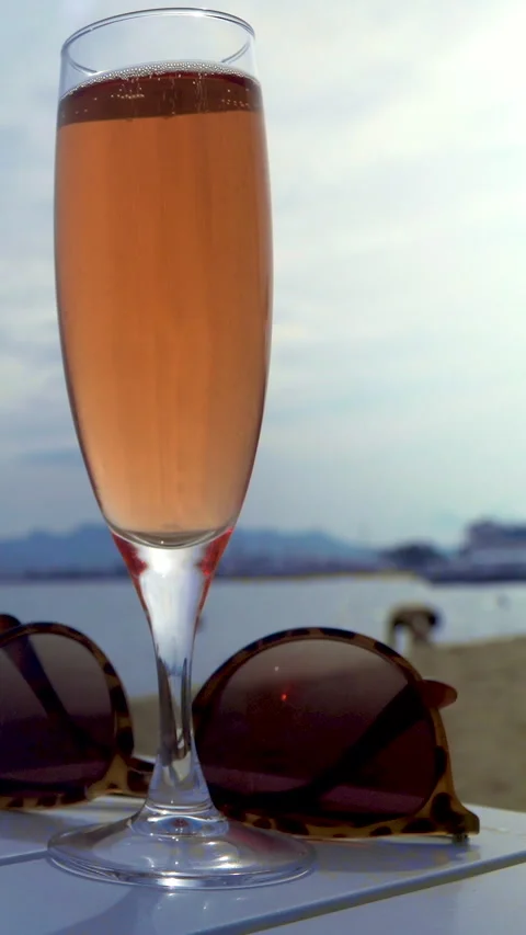 Pink champagne on beach. Vertical aspect. Stock Footage 280703109